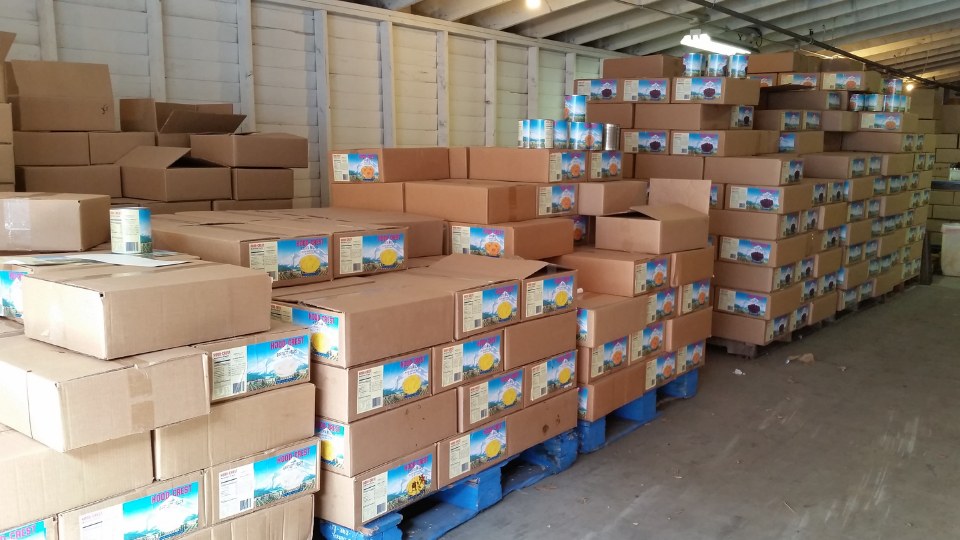 A large warehouse filled with boxes and pallets
